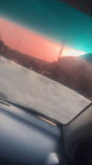 Sunset captured through car windshield in Nigeria