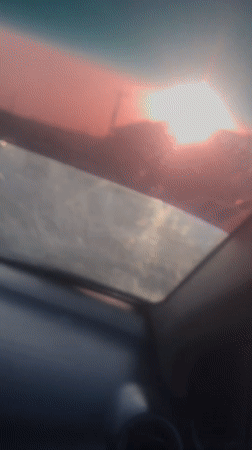 Sunset captured through car windshield in Nigeria