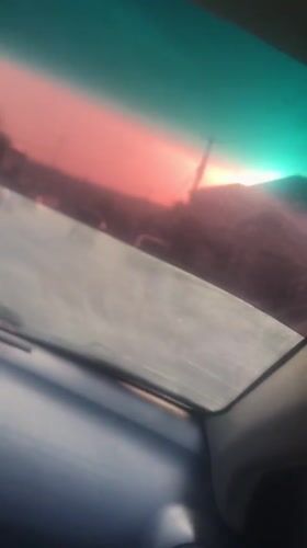 Sunset captured through car windshield in Nigeria