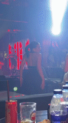 Late-night nightclub scene with live performance in Dubai
