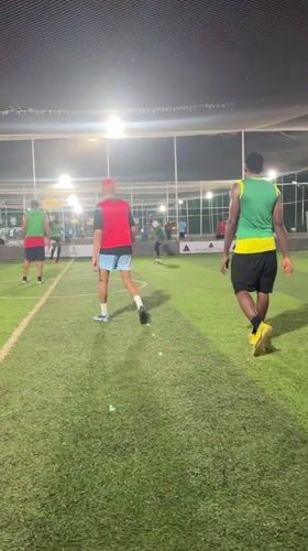 Nighttime soccer match documented at Abuja sports complex