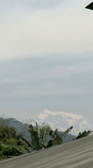 Urban views of hazy Annapurna mountains in Pokhara Nepal