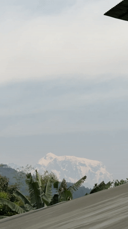 Urban views of hazy Annapurna mountains in Pokhara Nepal