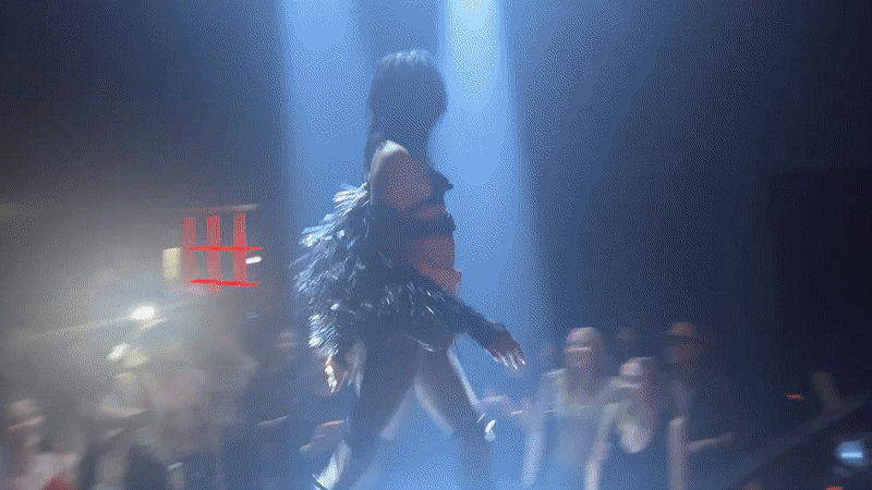 Performer dances on stage at Milan nightclub