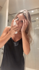 Post-shower hair routine in a Dubai bathroom