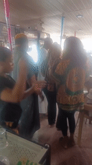 Cake celebration at bar venue captured from multiple angles