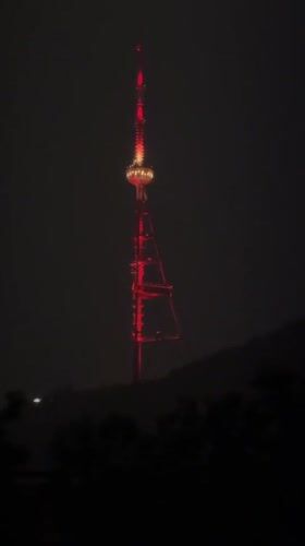 Tbilisi TV Tower documented in multiple perspectives over evening hours
