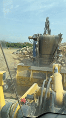 Construction worker operates rock crusher in Bulgarian village