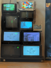 Stacked vintage televisions documented in Moscow indoor location
