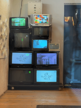 Stacked vintage televisions documented in Moscow indoor location