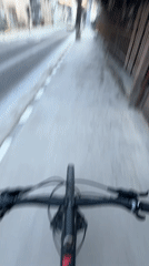 Early morning bicycle ride captured on Chepelare sidewalk