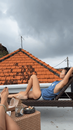 Women relax on rooftop patio in North Kuta Indonesia