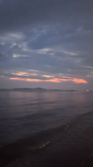 Sunset observed over ocean waters in Pattaya City, Thailand