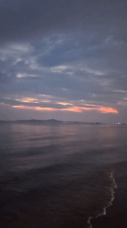 Sunset observed over ocean waters in Pattaya City, Thailand