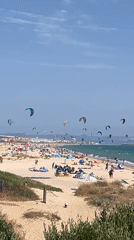 Tarifa beach in full summer swing: kites, crowds, and character