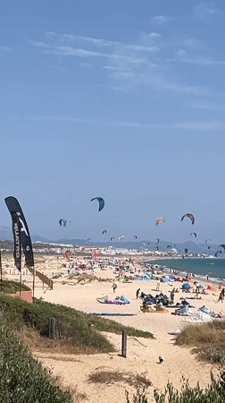 Tarifa beach in full summer swing: kites, crowds, and character