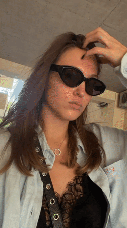 Elevator selfie in Tbilisi, light blue shirt and shades