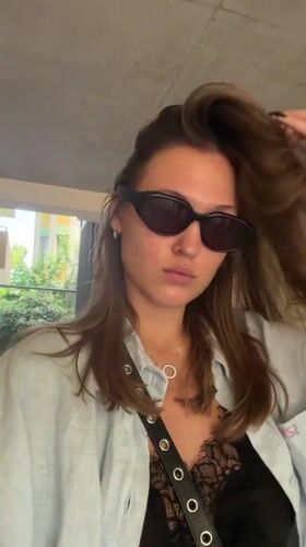 Elevator selfie in Tbilisi, light blue shirt and shades