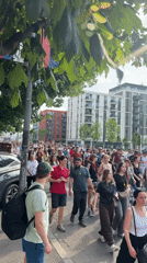Demonstrators march through Belgrade streets carrying Serbian flags