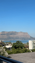 Poolside morning at a Sicilian coastal resort near Palermo