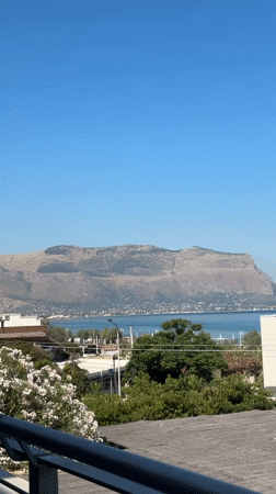 Poolside morning at a Sicilian coastal resort near Palermo