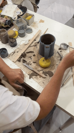Artist documents pottery workshop session in Ko Kaeo, Thailand