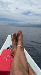 Boat journey recorded off Indonesian waters with passenger wearing shell anklet