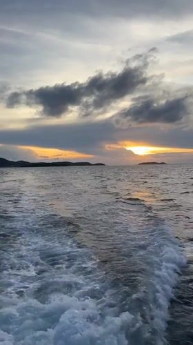 Boat passenger films sunset seascape off Pattaya coast