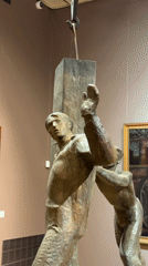 Bronze sculpture of struggling men captured in Moscow