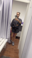 Woman tries on rhinestone sneakers at Abakan store