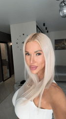Blonde woman photographed indoors during morning hours
