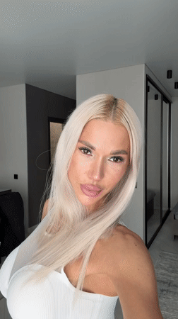 Blonde woman photographed indoors during morning hours