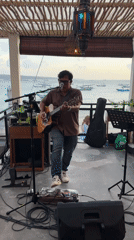 Beachfront gathering with live music and dining captured in Kuta