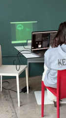 Person programs on laptop in Mexico City institutional setting