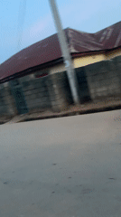 Street scene captured in Akwanga shows van, motorcycle, running boy