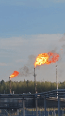 Gas flares burn at Russian industrial facility