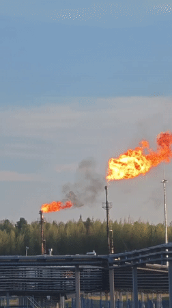 Gas flares burn at Russian industrial facility