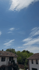 Sunny skies over traditional buildings documented in Milan