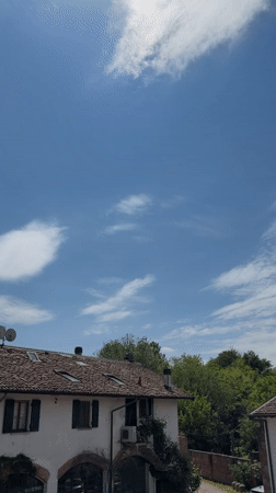 Sunny skies over traditional buildings documented in Milan