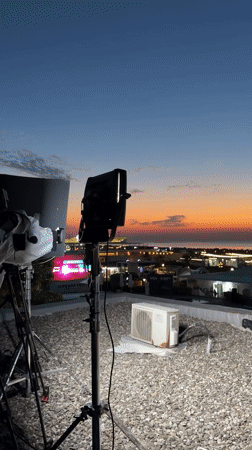 Rooftop lighting setup at dusk near the Azerbaijani coast