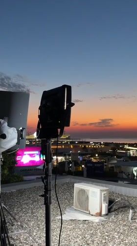 Rooftop lighting setup at dusk near the Azerbaijani coast