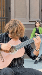 Street musicians perform in central Moscow amid urban activity