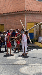 Religious procession featuring Jesus portrayal held in Venezuelan street