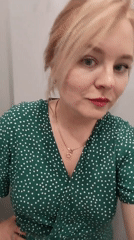 Woman takes playful selfies in green dress, Izhevsk