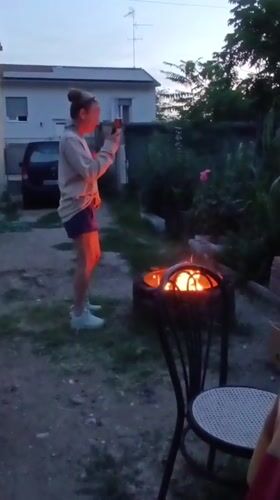 Evening backyard gathering with cooking and cat in Viadana