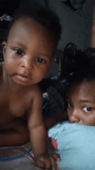 Morning childcare routines captured in bedroom setting