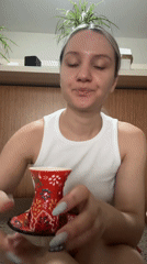 Woman enjoys traditional Turkish tea and food in Esenyurt