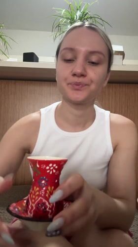 Woman enjoys traditional Turkish tea and food in Esenyurt