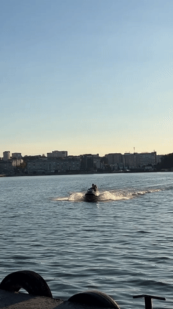 Graduation celebrations along Ternopil Pond at sunset