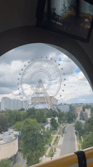 Moscow Ferris wheel offers cityscape view with pedestrians below